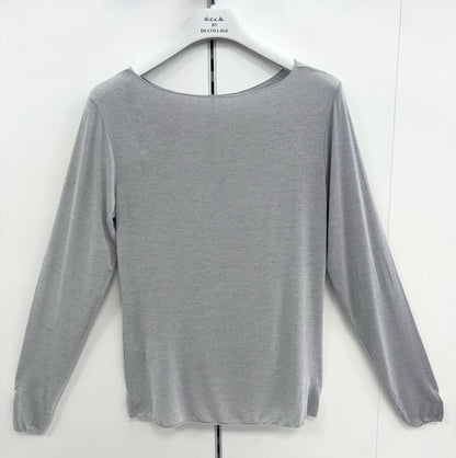 Gray long-sleeve top on a hanger against a white background