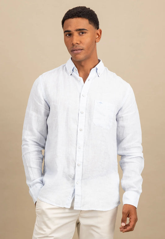Man wearing a white button-up shirt against a beige background