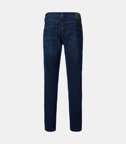 Back view of dark blue slim-fit jeans on a light gray background.