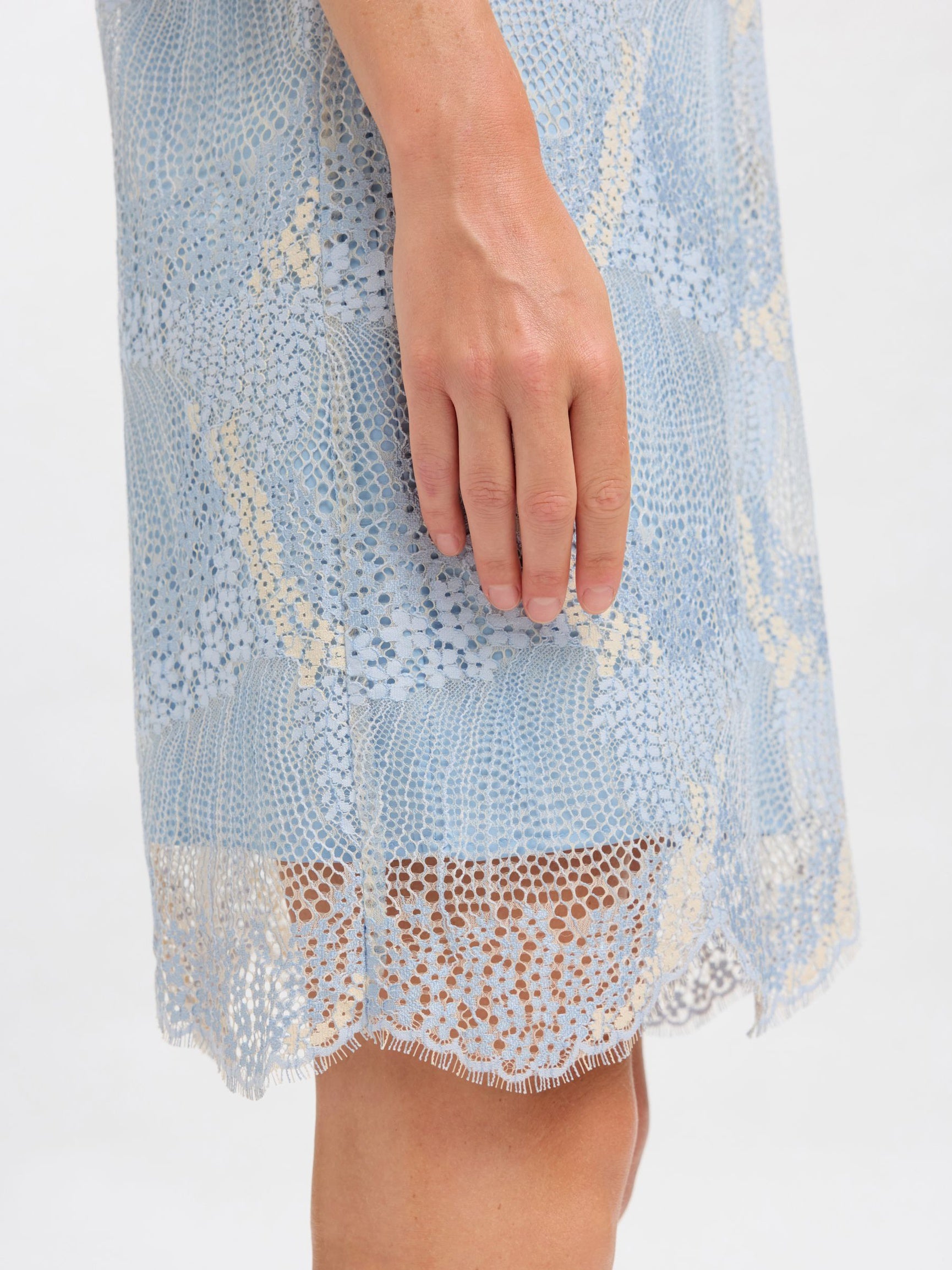 Light blue lace dress with a white background