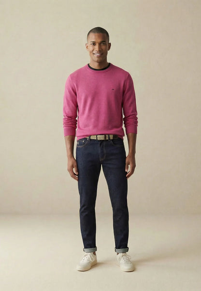 Men wearing pink jumper with dark denim jeans 