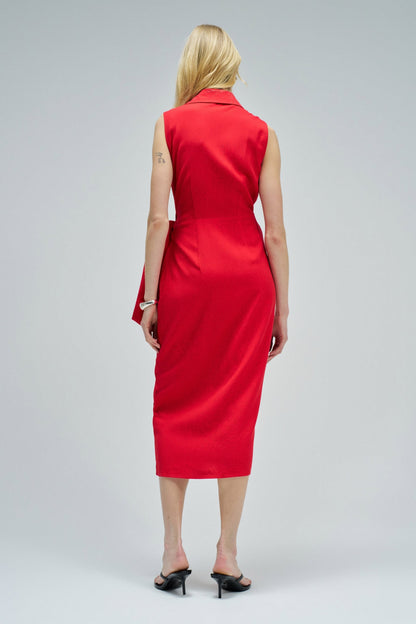 Woman wearing a red dress on a gray background