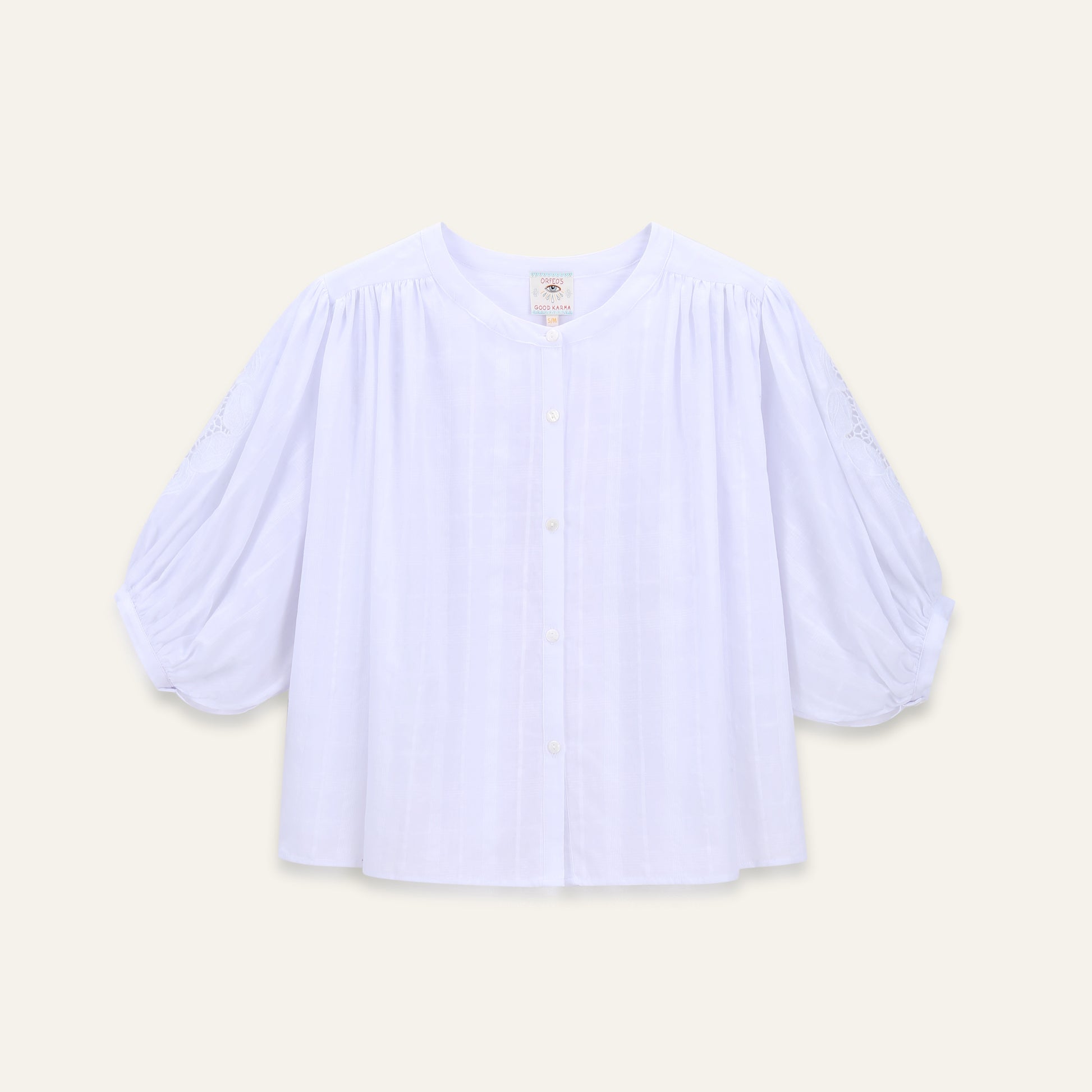 blouse with balloon sleeves on a beige background