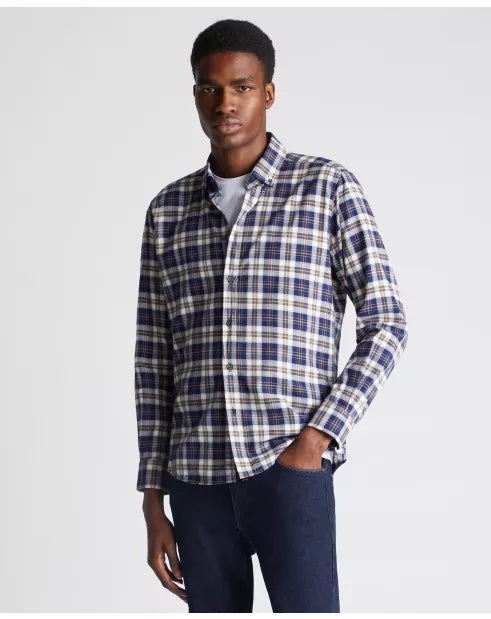 Man wearing a plaid shirt with a white background