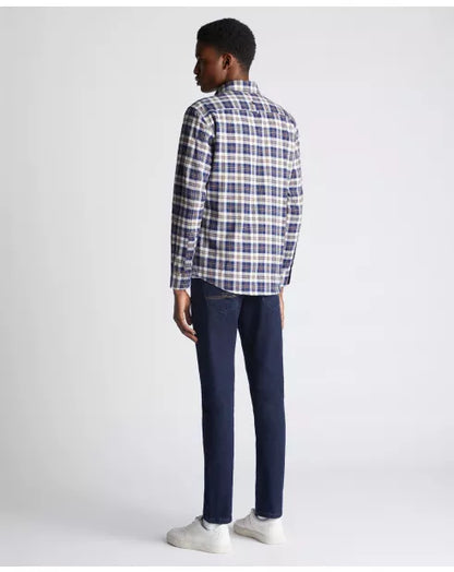 Person wearing a plaid shirt and dark pants on a white background