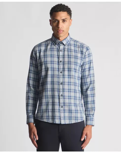 Man wearing a blue plaid shirt against a gray background