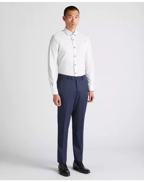 Man wearing a white dress shirt and navy pants on a white background