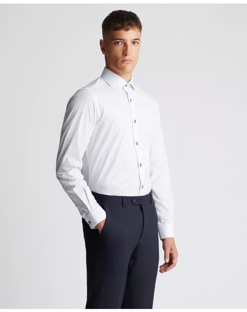 Man wearing a white dress shirt and dark pants against a light gray background