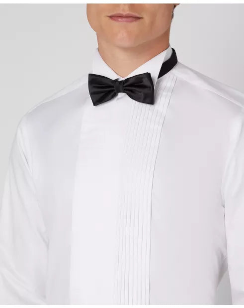 White dress shirt with a black bow tie on a plain background