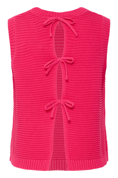 Pink knitted vest with bow details on a white background