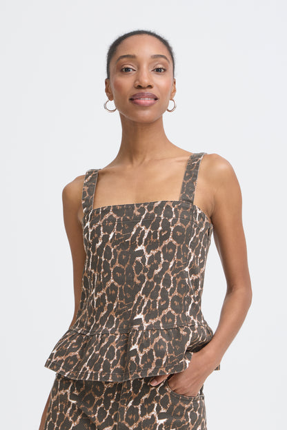 Woman wearing a leopard print top on a white background