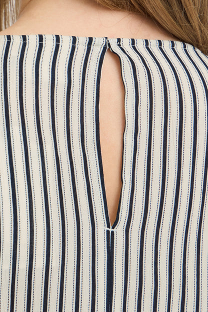 Close-up of a striped garment with a cut-out design.
