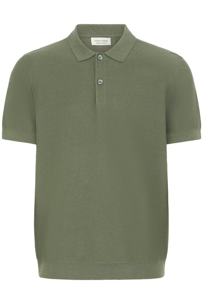 Green polo shirt on a white background