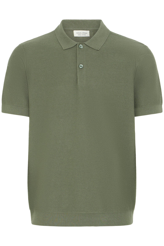 Green polo shirt on a white background
