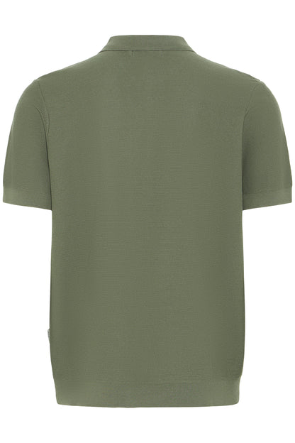 Green polo shirt on a white background