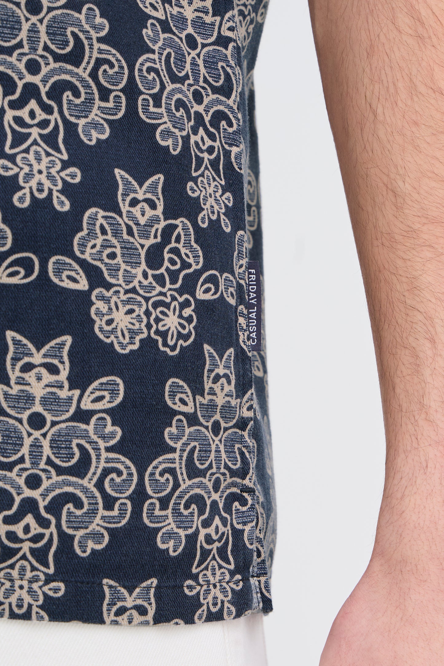 Navy blue fabric with beige floral pattern and 'Cafedelites' label on a white background