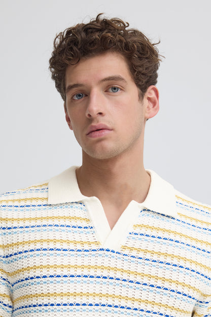 Man wearing a striped shirt against a plain background