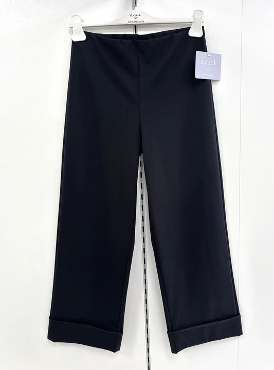 Black pants with a tag on a white background