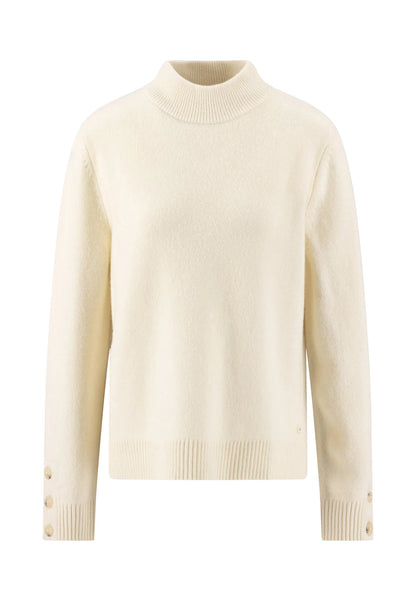 A cream-colored knit mock neck sweater with long sleeves, ribbed cuffs and hem, and decorative buttons on the cuffs, shown against a plain white background.