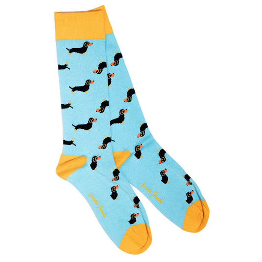 Light blue sock with dachshund pattern and yellow accents on a white background