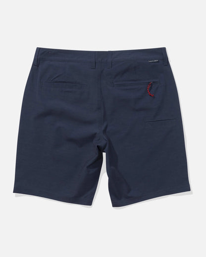 Navy shorts with a red tag on a white background