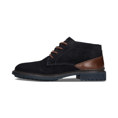 A single men's ankle boot in black suede with brown leather accents on the heel and laces, shown in a side profile against a white background.