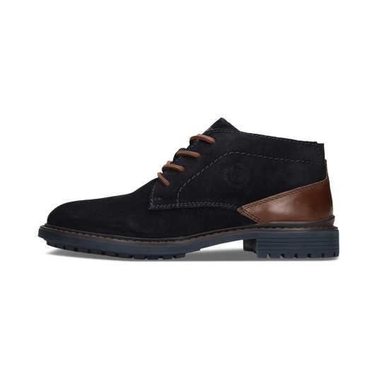 A single men's ankle boot in black suede with brown leather accents on the heel and laces, shown in a side profile against a white background.