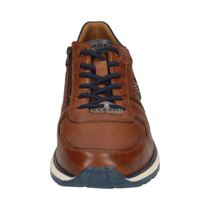 Brown leather shoe with black laces on a white background
