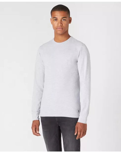 Man wearing a light gray long-sleeve shirt on a white background