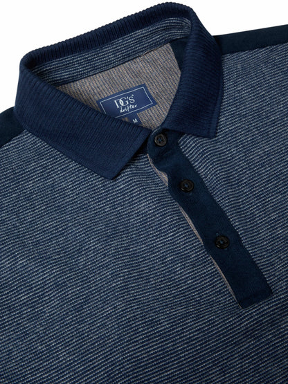 Close-up of a navy blue polo shirt with a textured heathered knit body, solid navy collar and placket, and a visible BO'S brand label inside the collar.