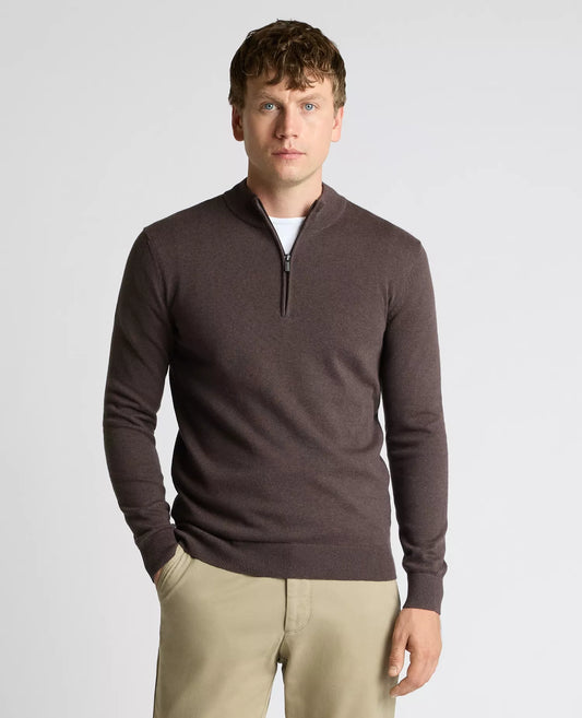 Man wearing a brown quarter-zip sweater against a light gray background