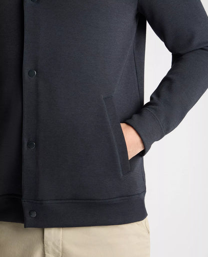 Close-up of a dark blue jacket with buttons on a white background