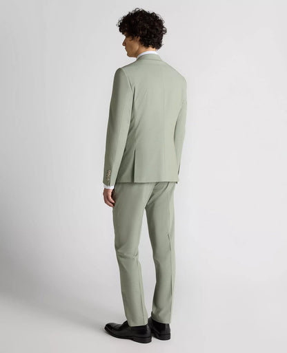 Man wearing a light green suit on a white background