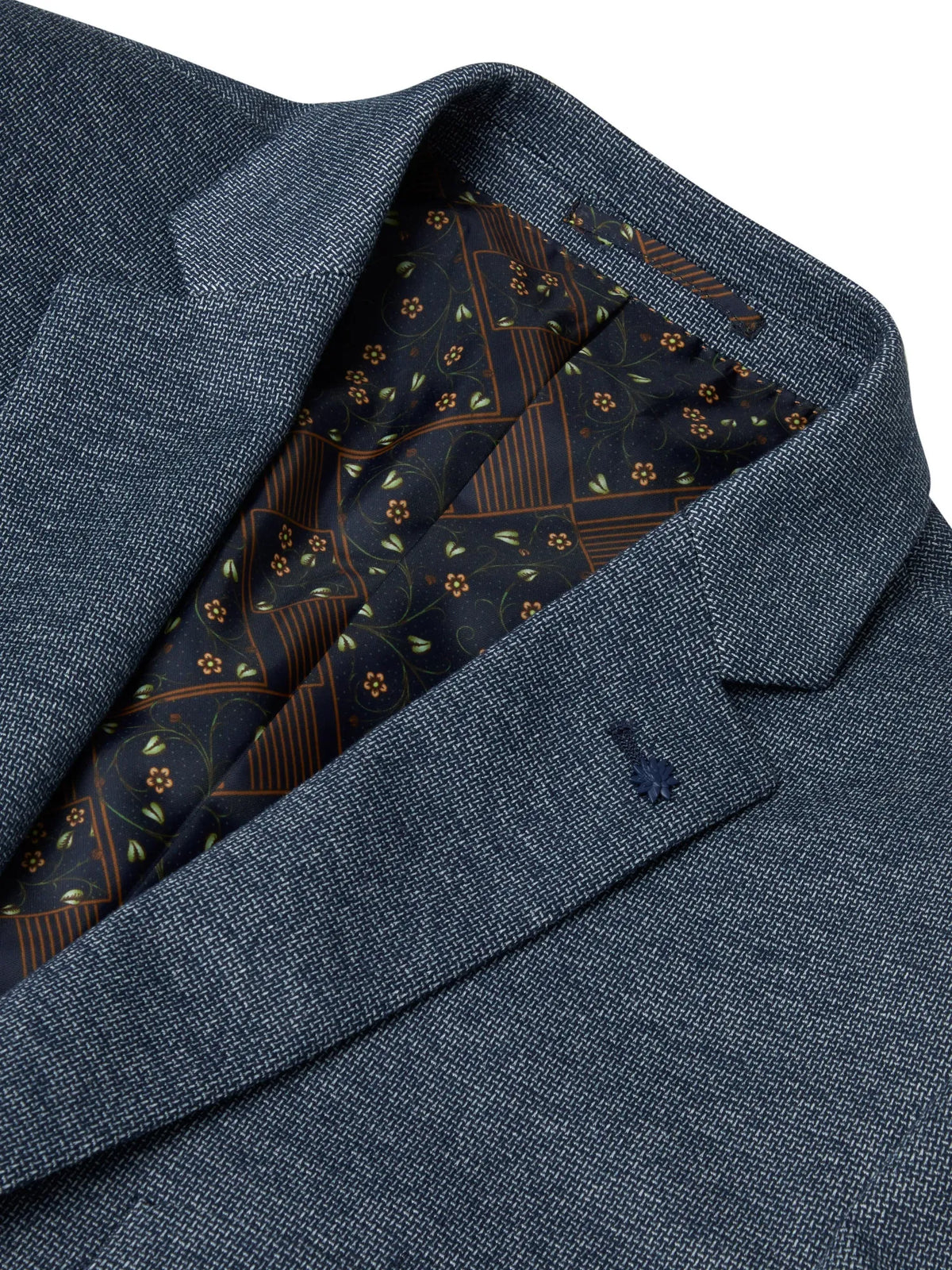 Close-up of a blue textured fabric with a patterned lining