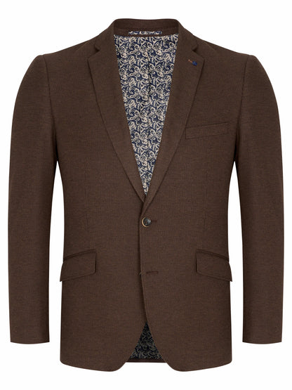 A men's brown blazer jacket with notch lapels, a single button closure, and flap pockets, shown against a plain white background. The interior lining features a blue and white floral pattern.