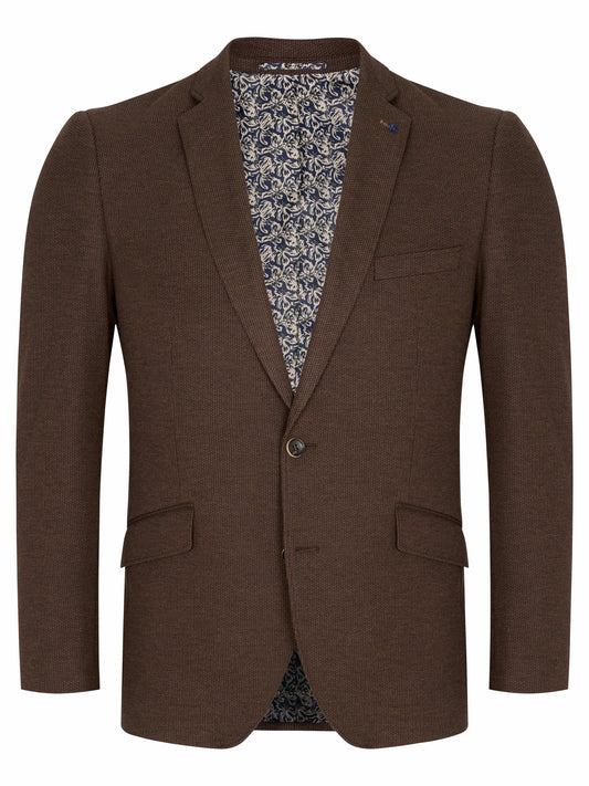 A men's brown blazer jacket with notch lapels, a single button closure, and flap pockets, shown against a plain white background. The interior lining features a blue and white floral pattern.