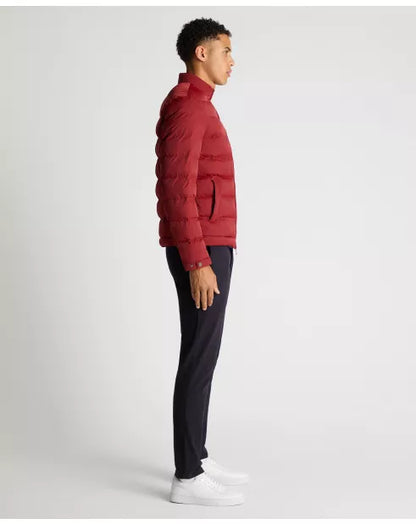 Person wearing a red puffer jacket and black pants on a white background