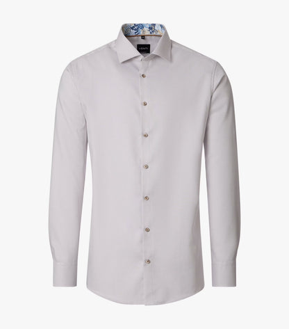 A light beige long-sleeve dress shirt with a button-down front and a patterned inner collar, displayed on a clean white background.