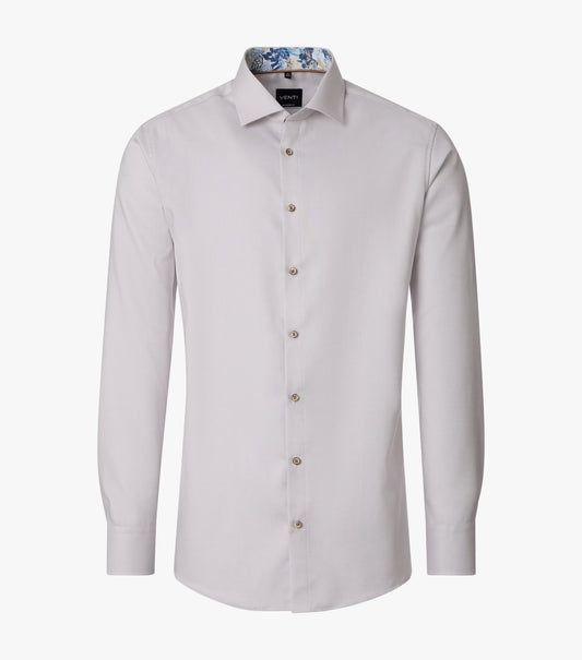 A light beige long-sleeve dress shirt with a button-down front and a patterned inner collar, displayed on a clean white background.