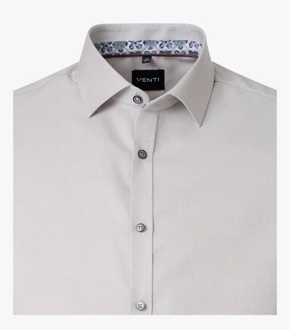 A close-up of a light beige Venti brand dress shirt, showing the collar, button-down front, and a patterned inner collar lining.