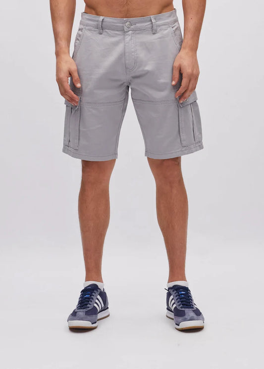 Person wearing light gray shorts on a white background