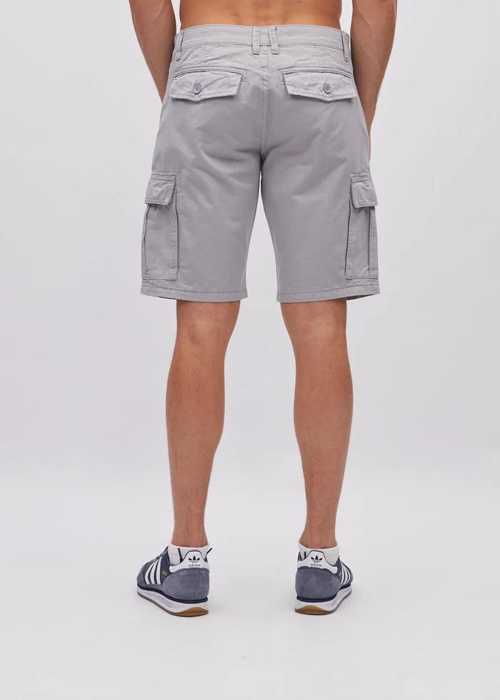 Person wearing gray cargo shorts on a white background