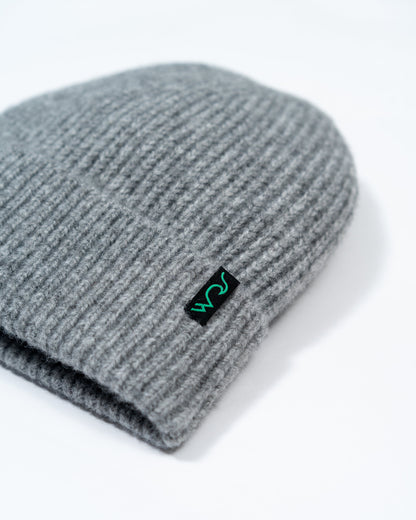 Gray knit beanie with a logo on a white background