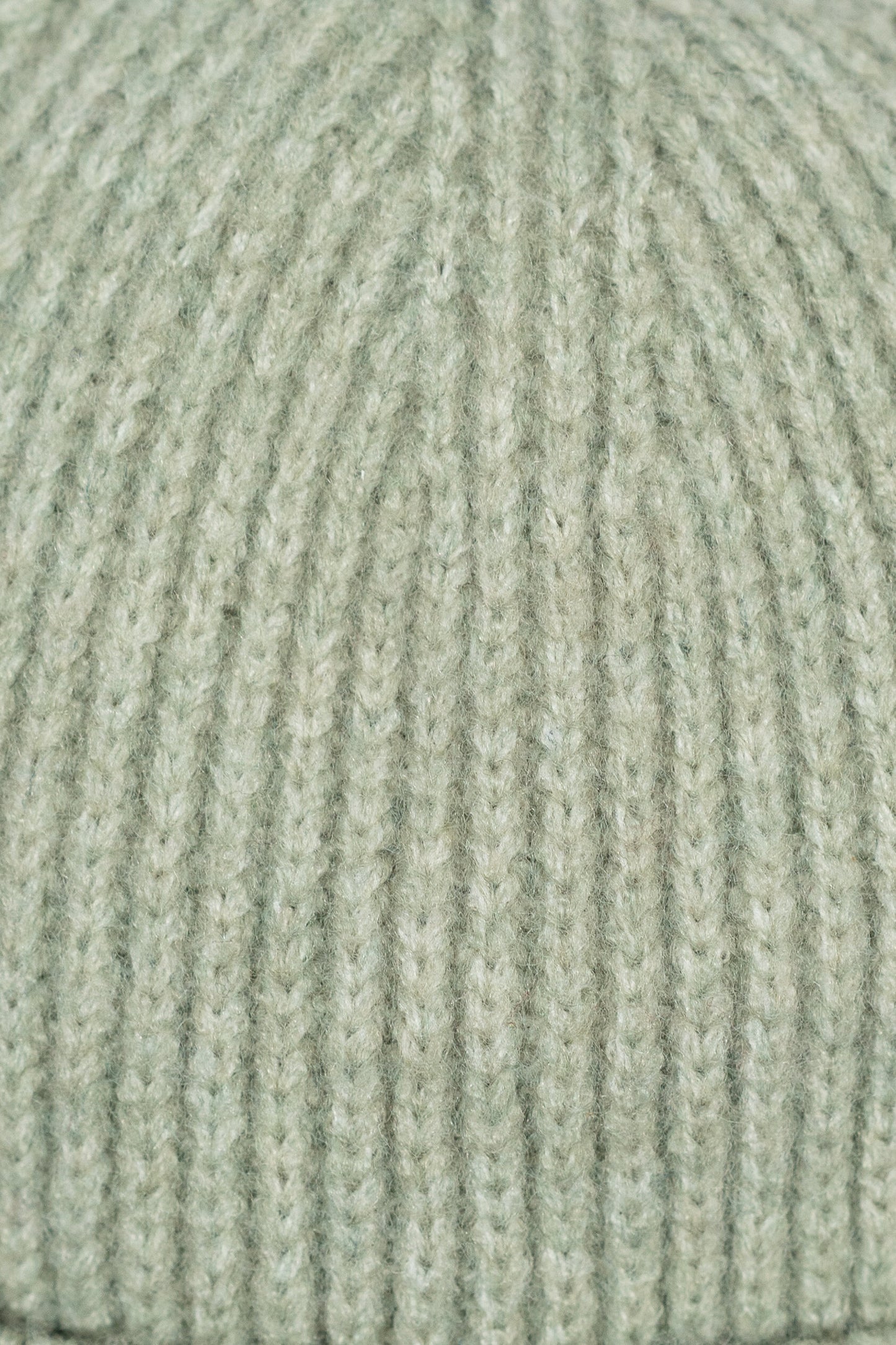 Close-up of a textured green fabric surface
