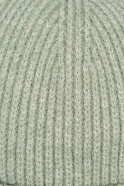 Close-up of a textured green fabric surface