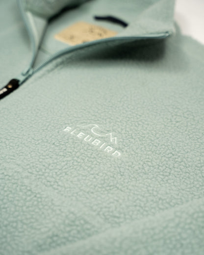 Light blue fleece jacket with Fleubird logo on a white background