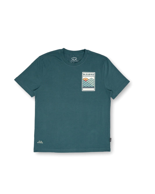 Teal t-shirt with a graphic design on a white background