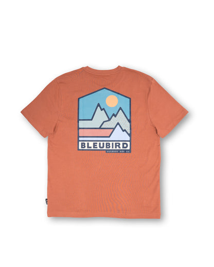 Orange t-shirt with a mountain graphic and 'BLEUBIRD' branding on a white background