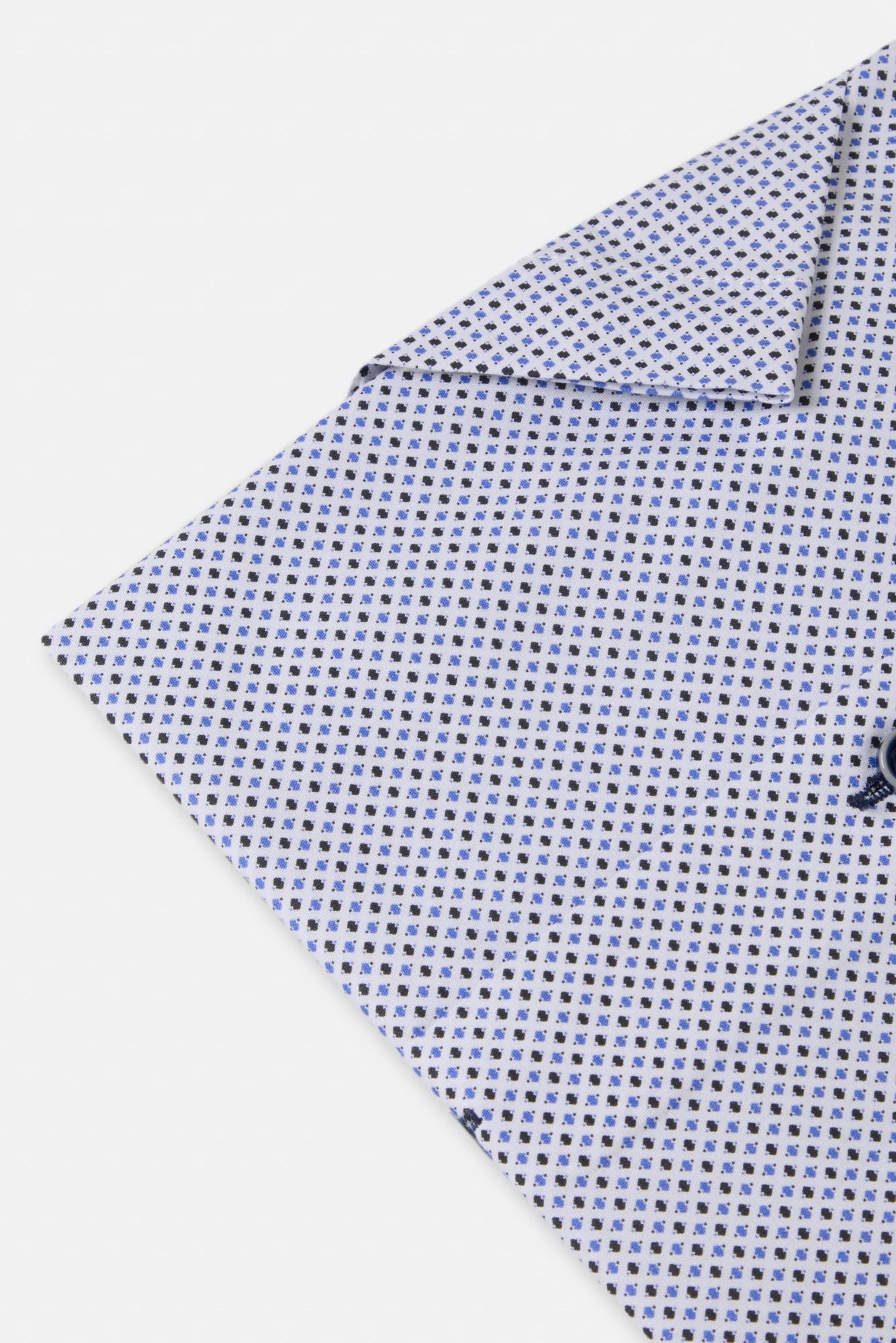Folded fabric with a small pattern on a white background