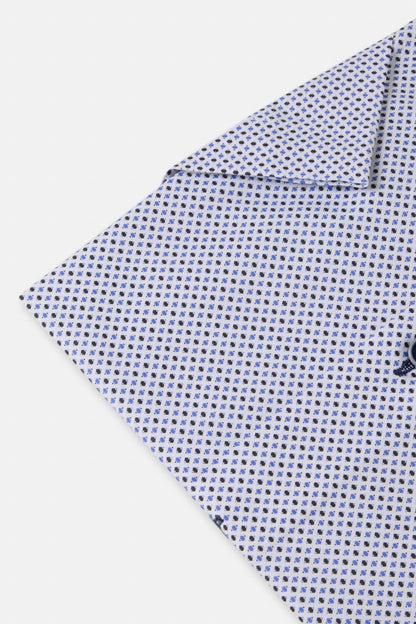Folded fabric with a small pattern on a white background